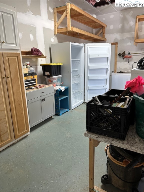 3242 Howard's Creek Road Boone, NC 28607 - Photo 24 of 33 a kitchen with a stove and a refrigerator