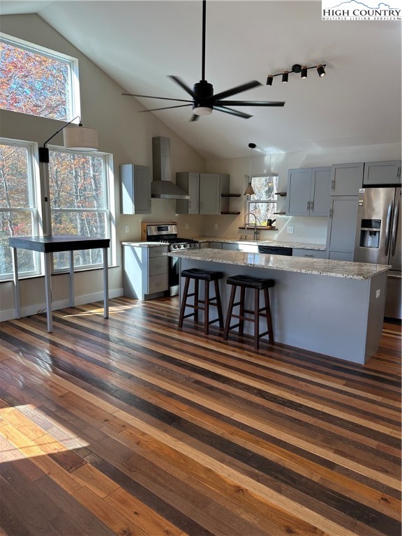 3242 Howard's Creek Road Boone, NC 28607 - Photo 10 of 33 a dining hall with stainless steel appliances granite countertop a stove and a wooden floors