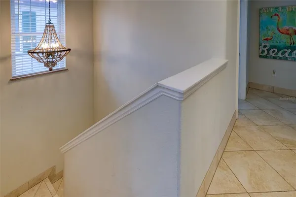 a view of staircase with white walls