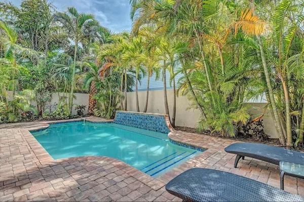 a view of a backyard with a garden