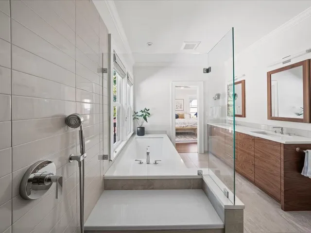 a bathroom with a tub and shower