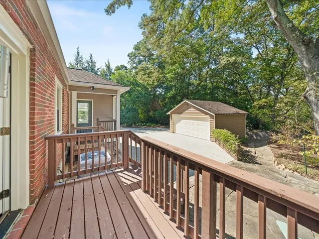 a view of a wooden deck and a yard