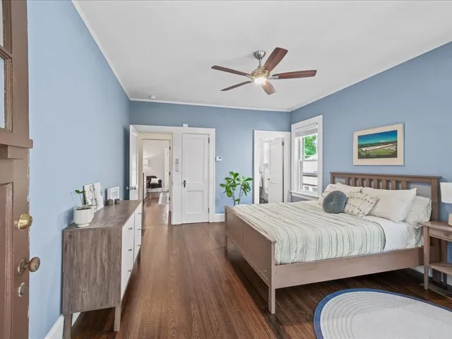 a bedroom with a bed and a dresser