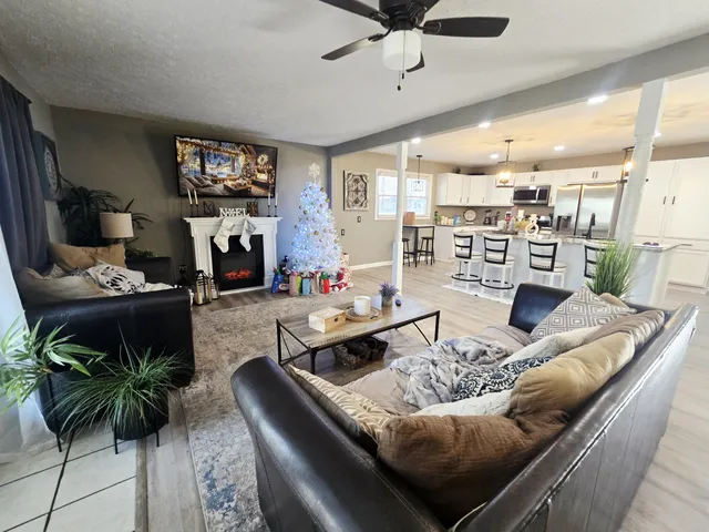 a living room with furniture and a flat screen tv