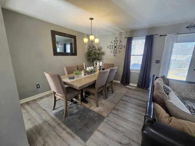 a view of a dining room with furniture