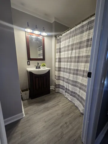 a bathroom with a sink and mirror