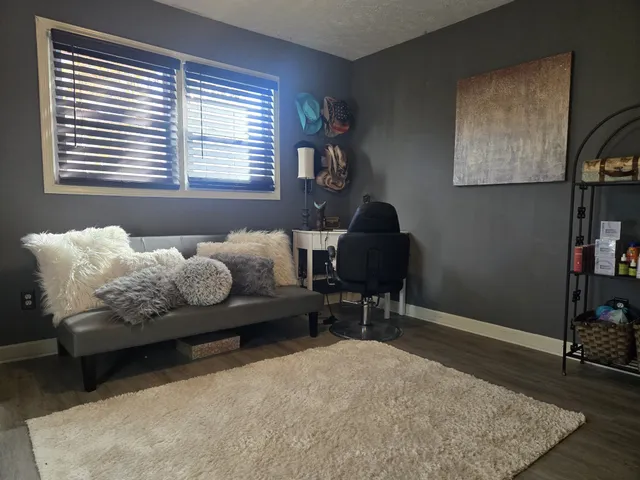 a bedroom with furniture and a window