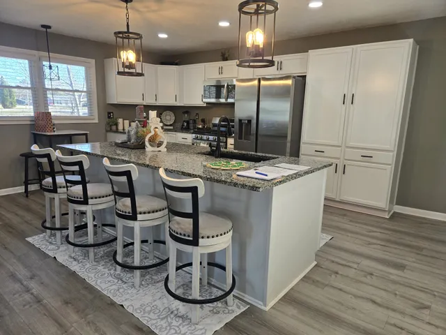 a kitchen with lots of counter space and appliances