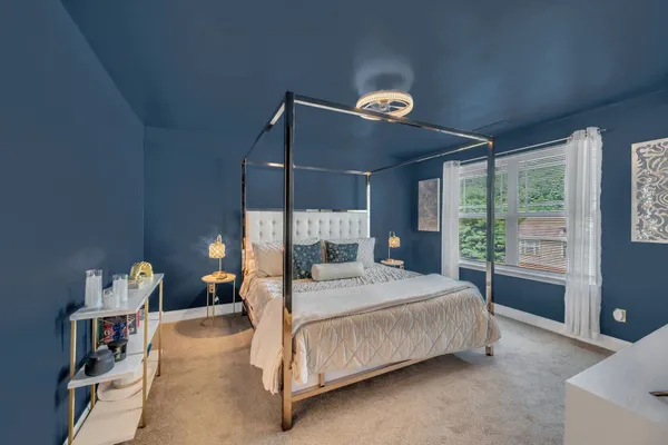 a bedroom with a bed and window