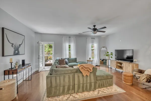 a living room with furniture and a flat screen tv