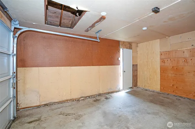 a view of a backyard with a tree