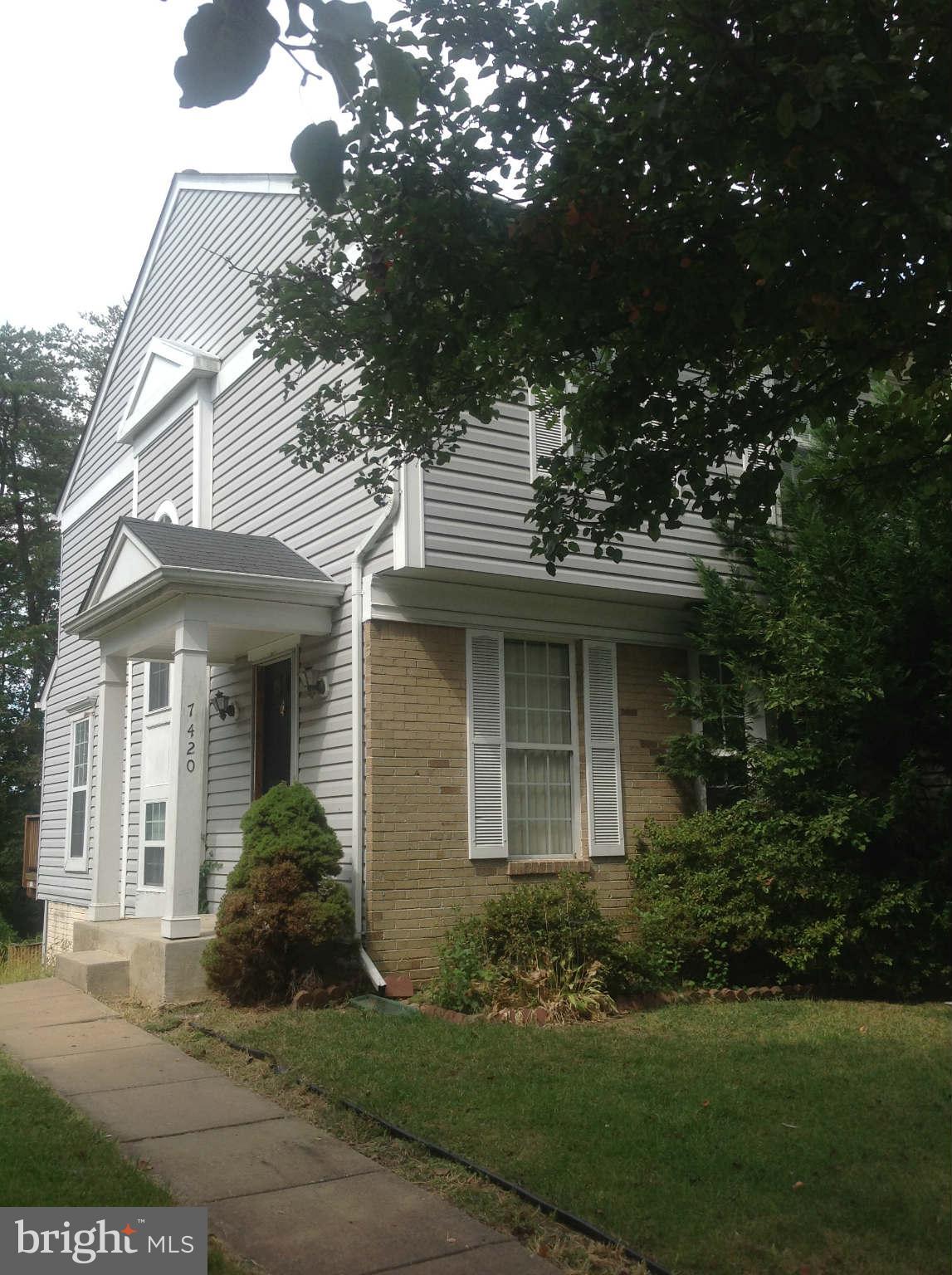 7420 Maury Road Baltimore, MD 21244 - Photo 1 of 3 a front view of a house with a yard