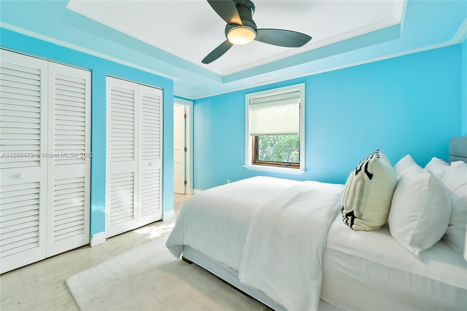 2153 North Bay Road Miami Beach, FL 33140 - Photo 11 of 19 a bedroom with a bed and a window