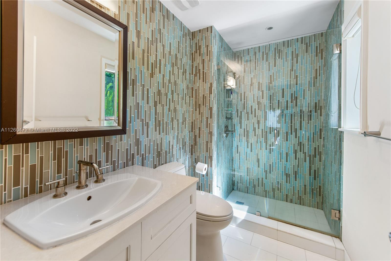 2153 North Bay Road Miami Beach, FL 33140 - Photo 12 of 19 a bathroom with a sink a toilet and shower