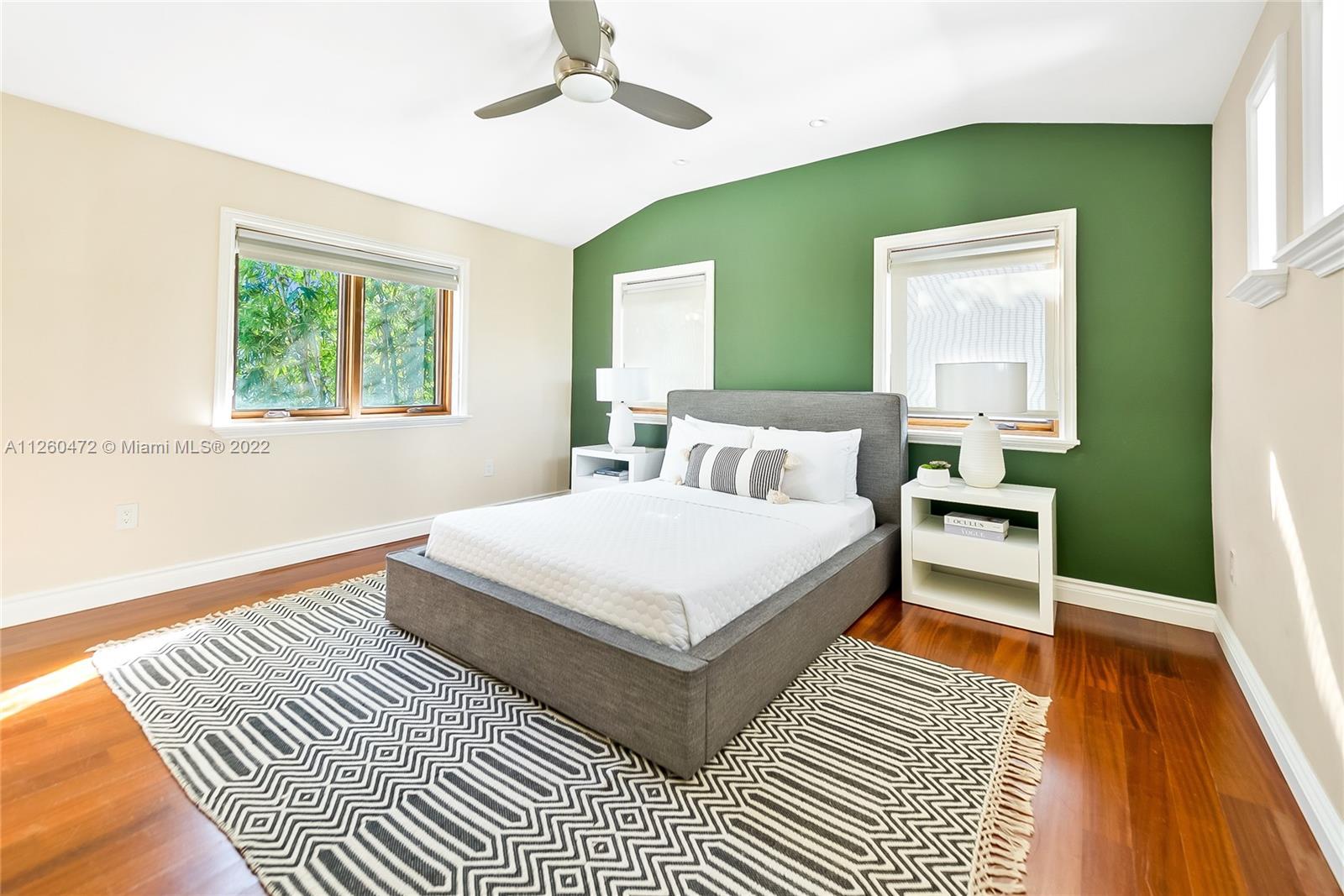 2153 North Bay Road Miami Beach, FL 33140 - Photo 13 of 19 a bedroom with a bed lamp and a large window