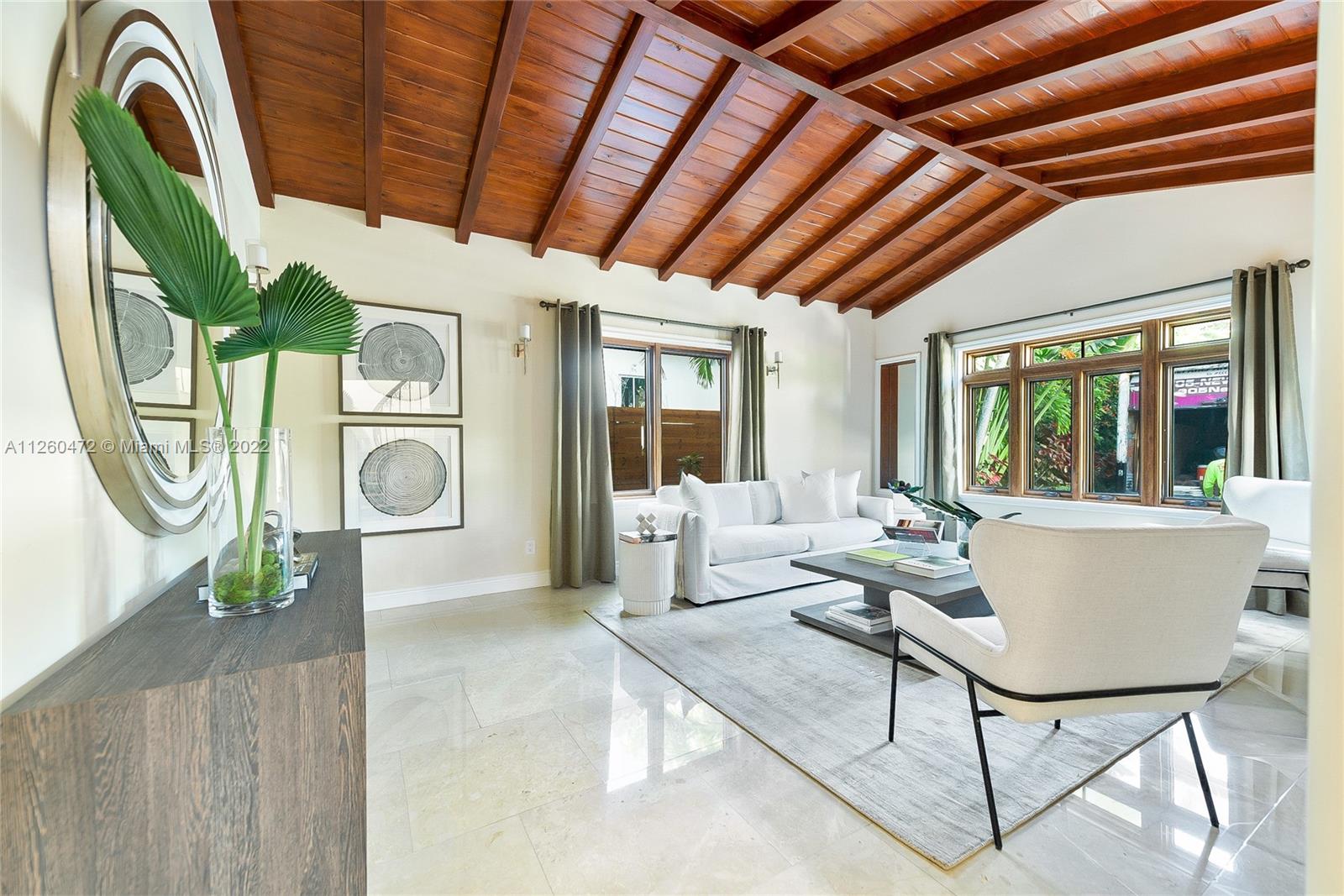 2153 North Bay Road Miami Beach, FL 33140 - Photo 3 of 19 a living room with patio furniture and a large window
