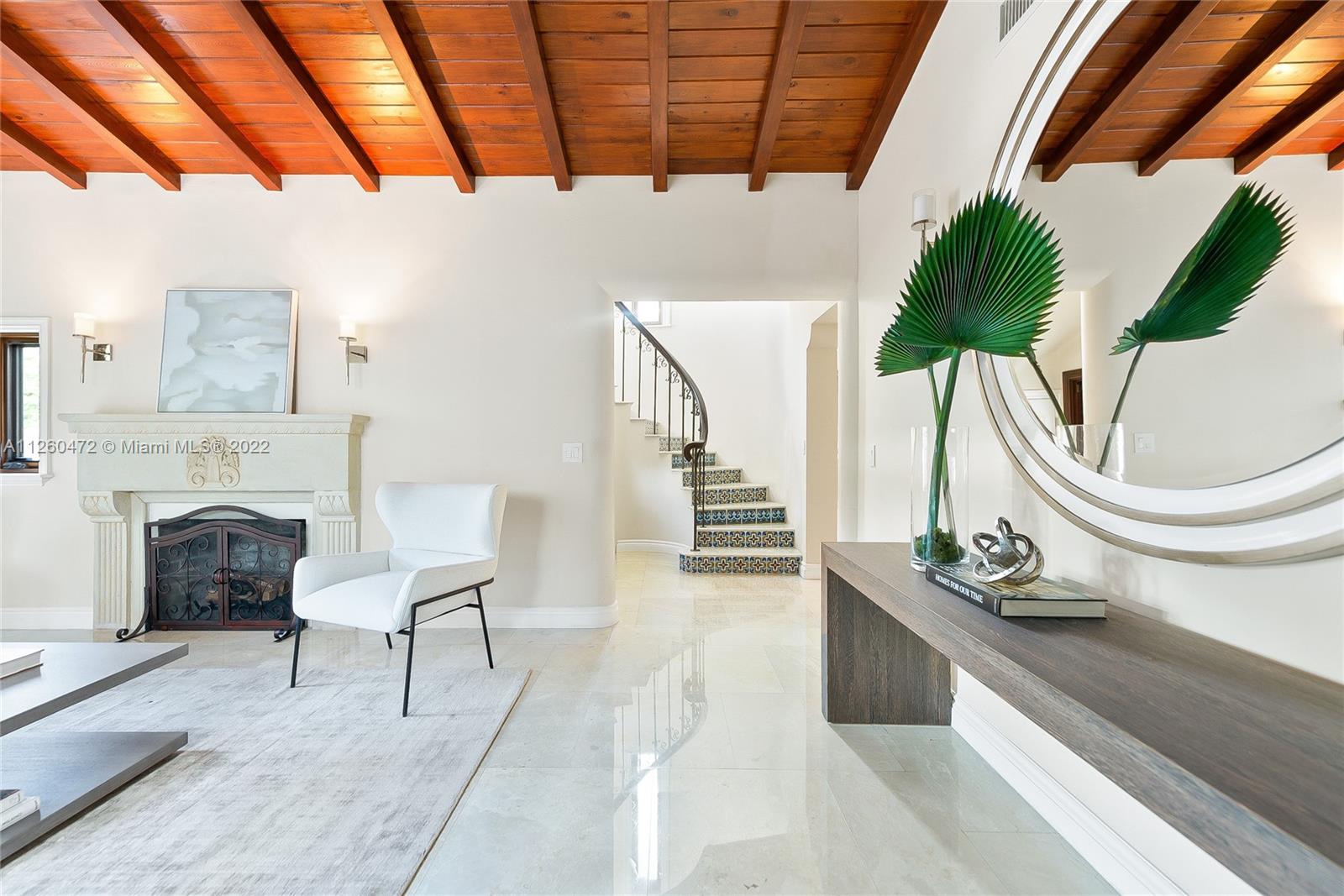 2153 North Bay Road Miami Beach, FL 33140 - Photo 4 of 19 a living room with furniture and a fireplace