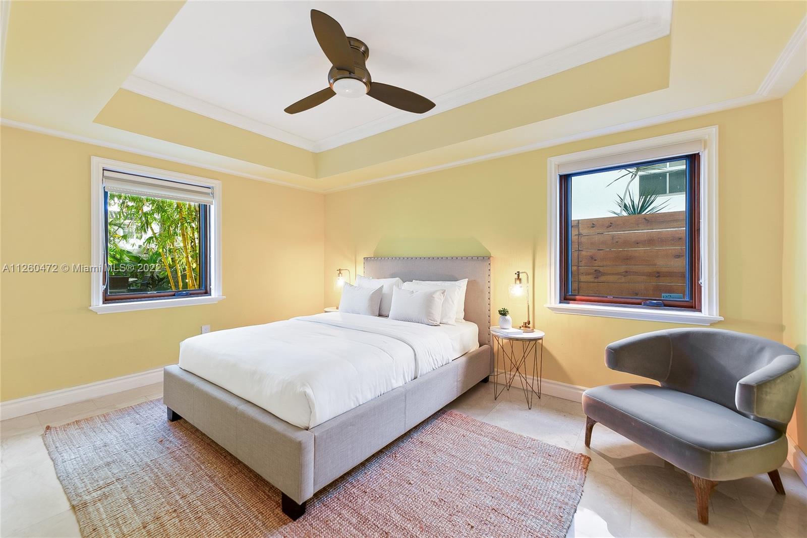 2153 North Bay Road Miami Beach, FL 33140 - Photo 9 of 19 a bedroom with a bed couch and window