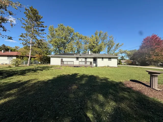 a view of house with garden space and trees