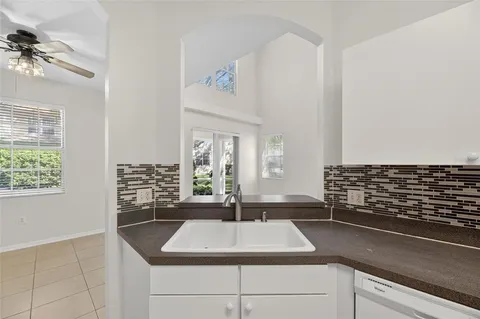 a kitchen with sink and window