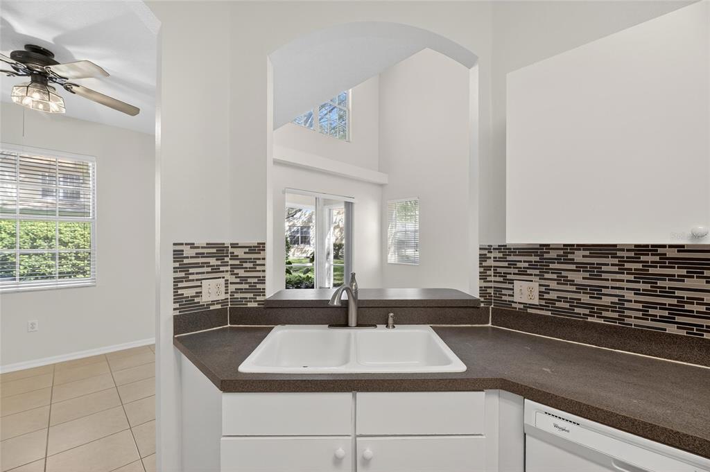 6418 Rosefinch Court, Unit 103 Lakewood Ranch, FL 34202 - Photo 13 of 52 a kitchen with sink and window