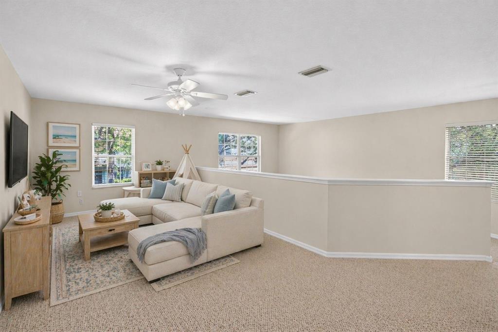 6418 Rosefinch Court, Unit 103 Lakewood Ranch, FL 34202 - Photo 17 of 48 a living room with furniture and a large window