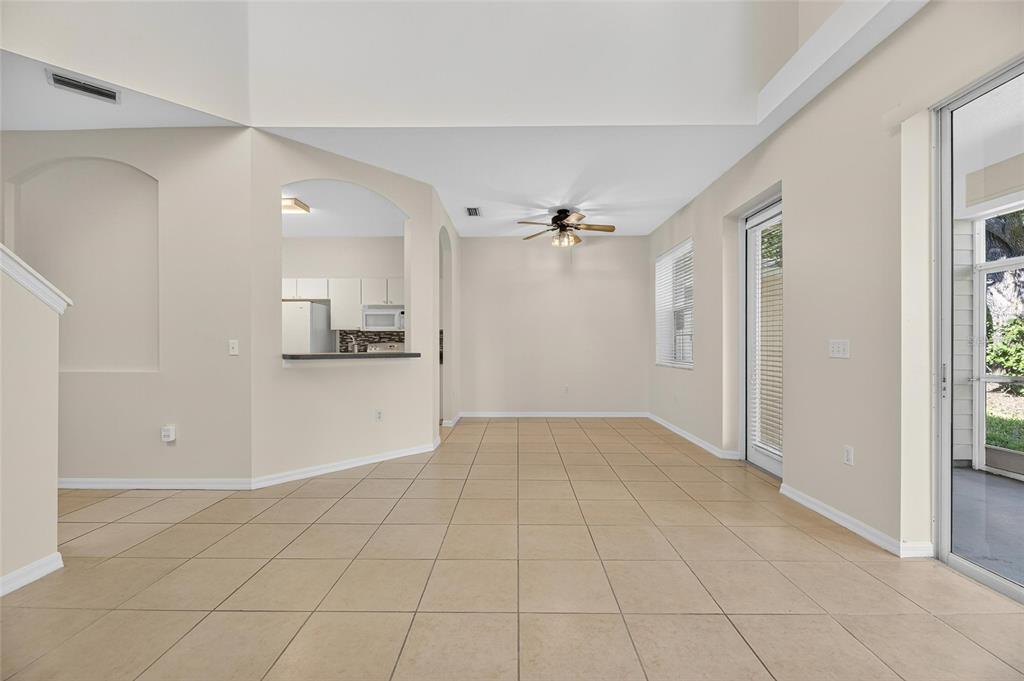 6418 Rosefinch Court, Unit 103 Lakewood Ranch, FL 34202 - Photo 20 of 52 a view of a kitchen with a sink and an empty room