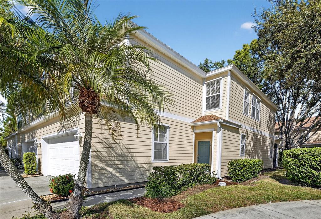 6418 Rosefinch Court, Unit 103 Lakewood Ranch, FL 34202 - Photo 2 of 52 a view of a house with a yard