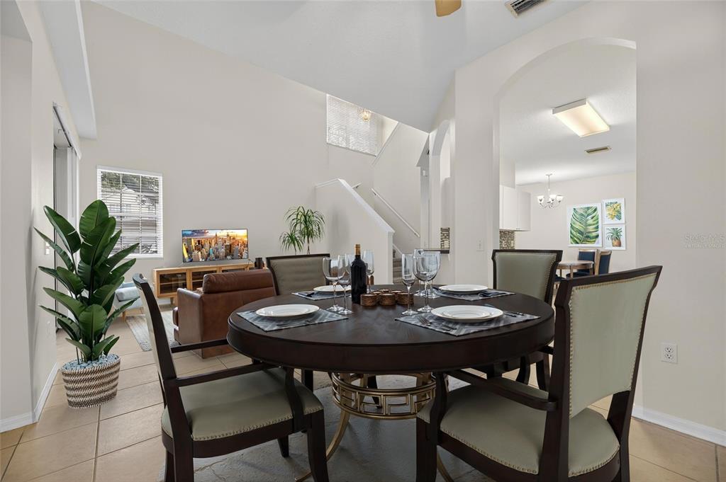 6418 Rosefinch Court, Unit 103 Lakewood Ranch, FL 34202 - Photo 24 of 52 a view of a dining room with furniture and wooden floor