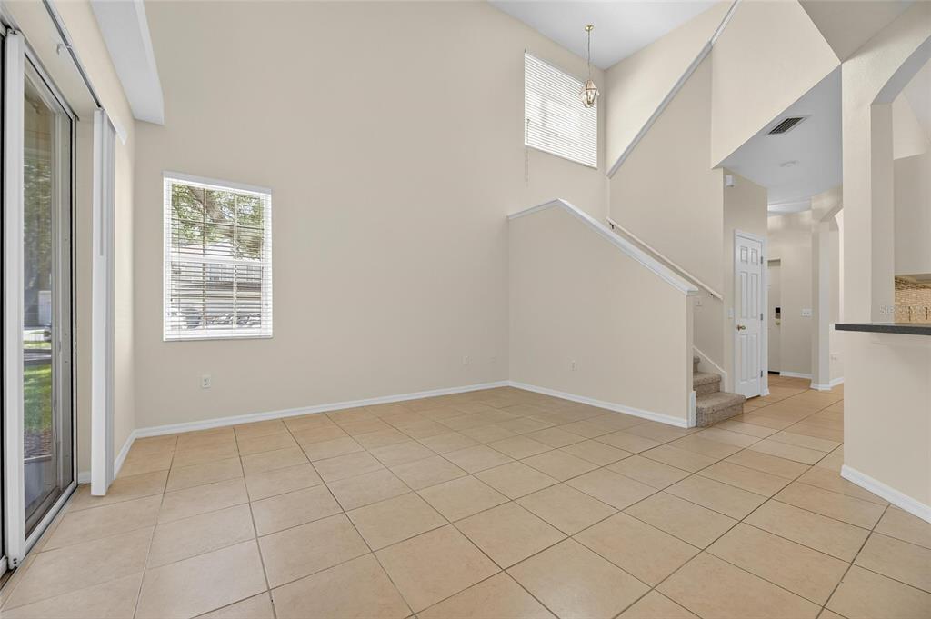 6418 Rosefinch Court, Unit 103 Lakewood Ranch, FL 34202 - Photo 25 of 52 a view of an entryway with white walls and windows