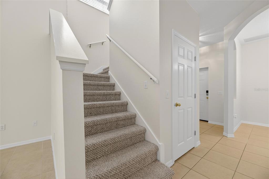 6418 Rosefinch Court, Unit 103 Lakewood Ranch, FL 34202 - Photo 26 of 52 a view of entryway with white walls and open door