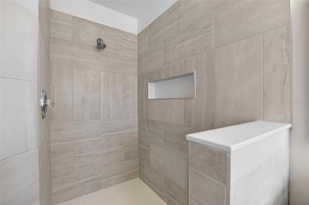 6418 Rosefinch Court, Unit 103 Lakewood Ranch, FL 34202 - Photo 33 of 48 a bathroom with a shower