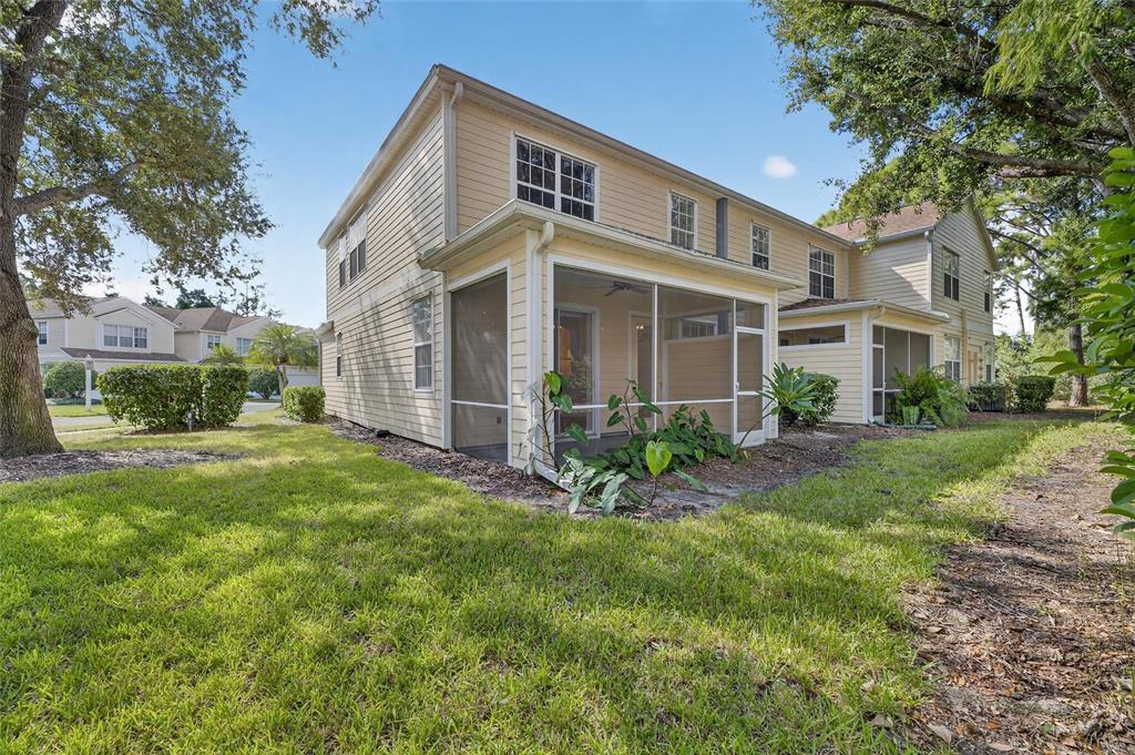 6418 Rosefinch Court, Unit 103 Lakewood Ranch, FL 34202 - Photo 38 of 48 a front view of a house with a yard and porch