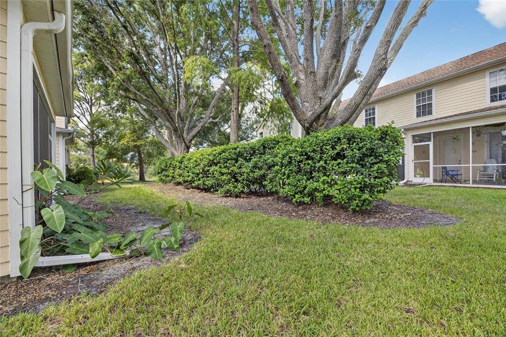 6418 Rosefinch Court, Unit 103 Lakewood Ranch, FL 34202 - Photo 39 of 48 a view of a house with a garden