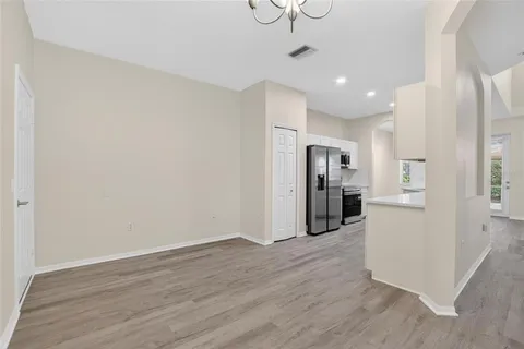 a kitchen with stainless steel appliances granite countertop a sink stove and microwave