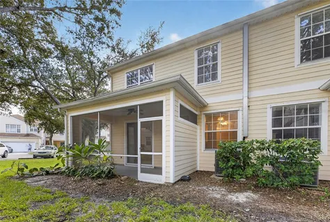 a front view of a house with a yard and porch