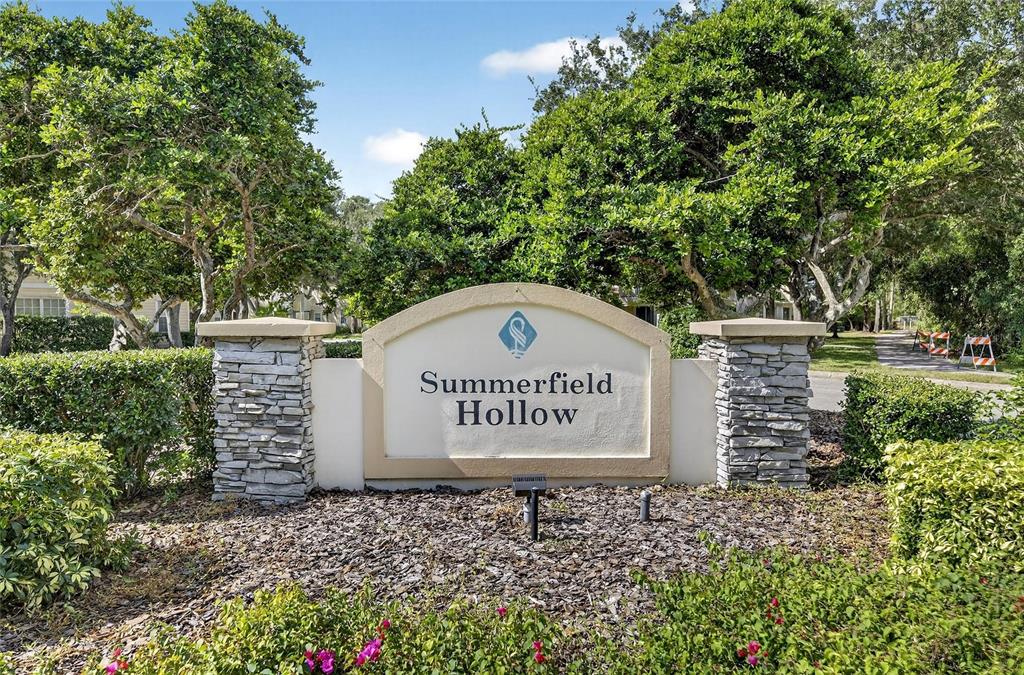 6418 Rosefinch Court, Unit 103 Lakewood Ranch, FL 34202 - Photo 45 of 48 a sign on the side of the road