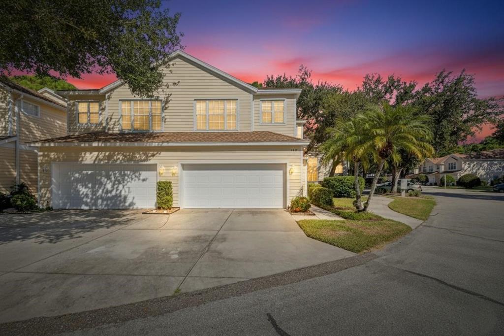 6418 Rosefinch Court, Unit 103 Lakewood Ranch, FL 34202 - Photo 46 of 48 a view of a house with a yard and a garage