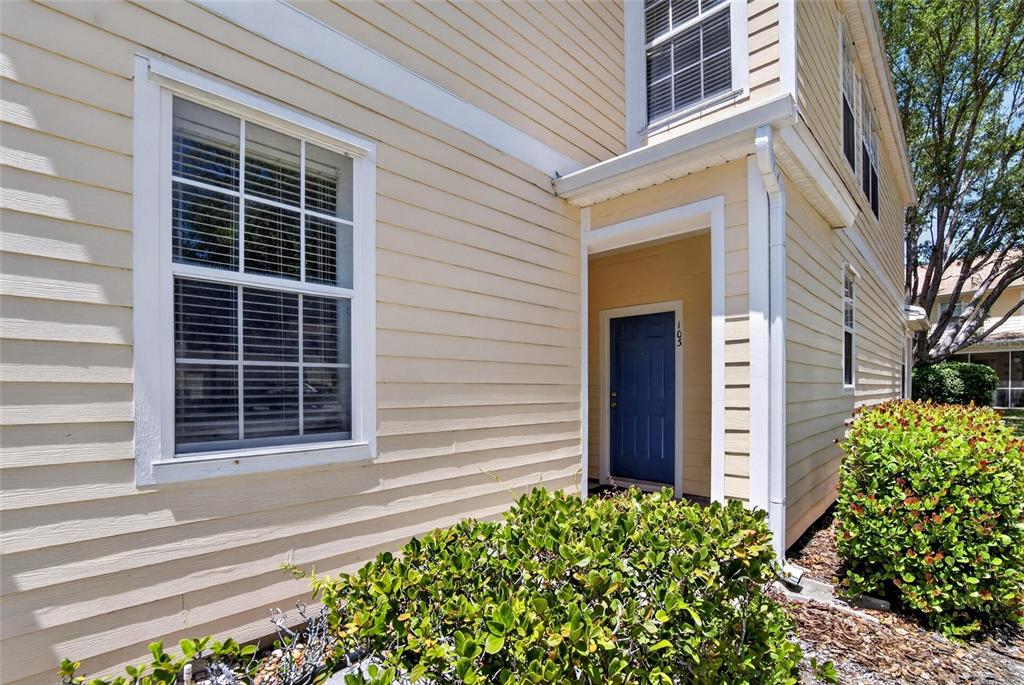 6418 Rosefinch Court, Unit 103 Lakewood Ranch, FL 34202 - Photo 47 of 48 a front view of a house with a garden