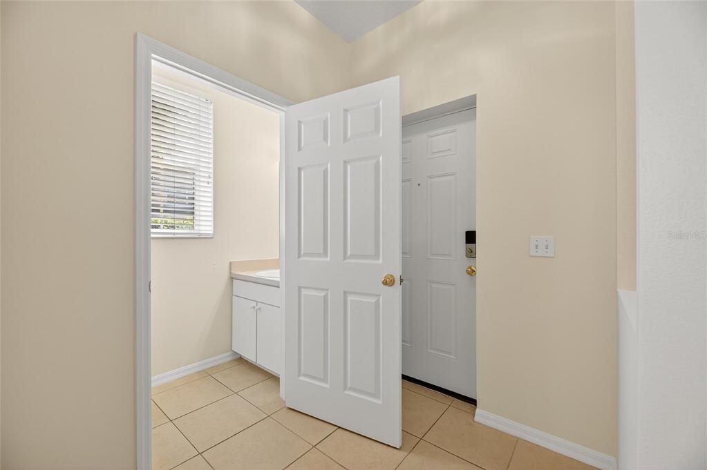 6418 Rosefinch Court, Unit 103 Lakewood Ranch, FL 34202 - Photo 5 of 52 a view of empty room with windows