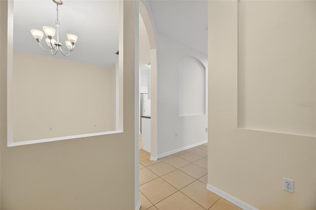 6418 Rosefinch Court, Unit 103 Lakewood Ranch, FL 34202 - Photo 7 of 52 en empty room with wooden floor