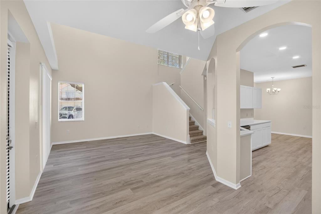 6418 Rosefinch Court, Unit 103 Lakewood Ranch, FL 34202 - Photo 10 of 48 a view of entryway and hall with wooden floor