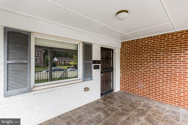 a view of a room with a large window