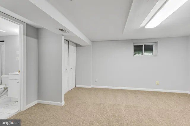 a bathroom with a toilet a sink and shower