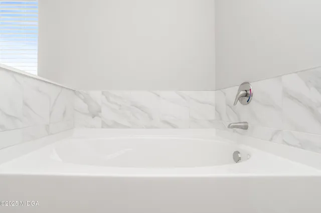 a sign that is sitting in front of flowers