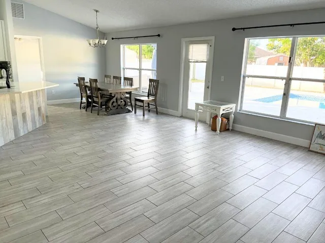 a view of a livingroom with furniture window and outside view