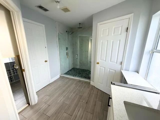 a view of an entryway with wooden floor