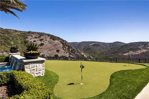 a view of a swimming pool with a yard