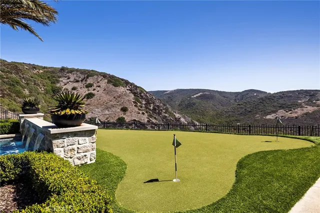 a view of a swimming pool with a yard