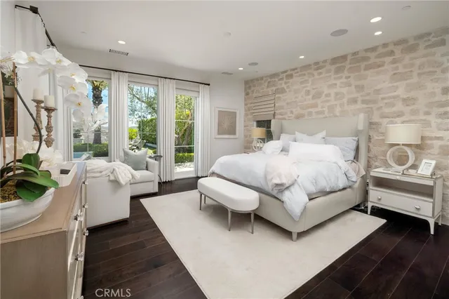 a bedroom with a bed and a couch